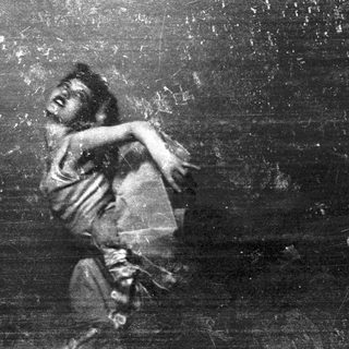 A person appears to be falling or dancing dramatically.