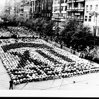 Large group arranged in a human pixelated image.