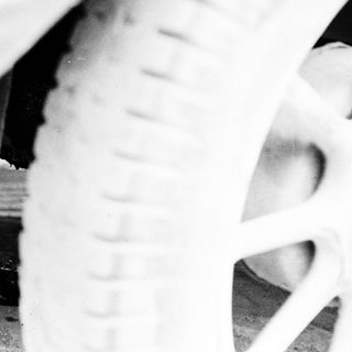 Close-up of a vintage tire with a textured tread.