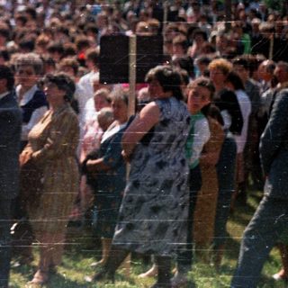 Large crowd gathered outdoors, possibly for a public event.