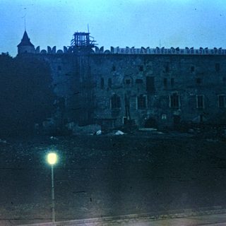 Nighttime view of a large building with a star.