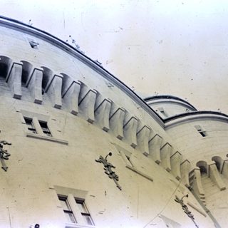 Close-up of an ornate, arched building facade.