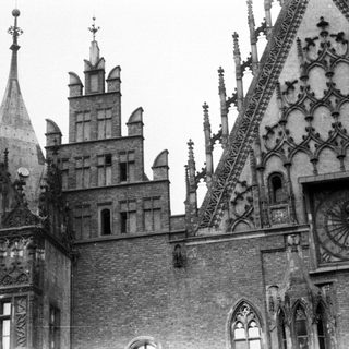 Black and white photo of ornate, historic building architecture.