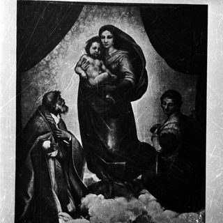 Mary holding baby Jesus with angels and figures below.