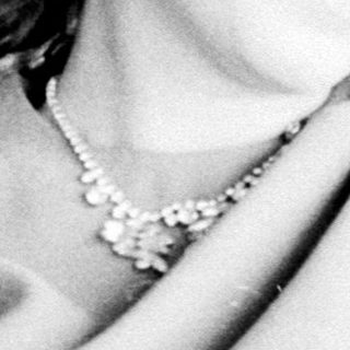 Woman holds her hand up to her armpit.