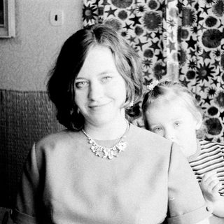 Woman and child portrait, vintage black and white photography.
