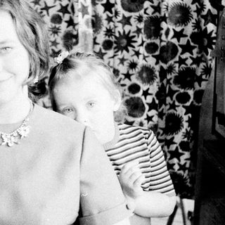 Woman and child portrait, vintage black and white photography.