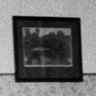 Person sleeping in a bed inside a room.