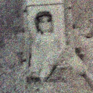 Here's a brief summary of the image: Appears to show several figures in a dark, unclear outdoor setting.