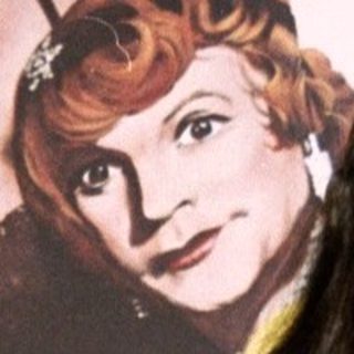 Woman stands before "Some Like It Hot" movie poster.