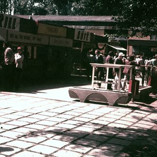 Vintage train ride with passengers in a public space.