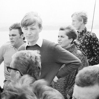 Group of people on a boat, likely fishing.