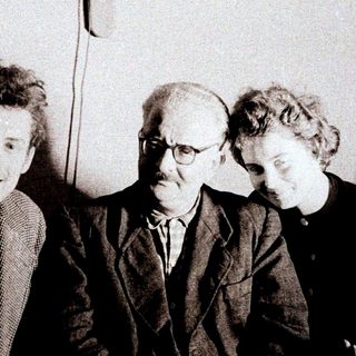 Einstein, Bohr, and Pauli photographed together in a seated group.