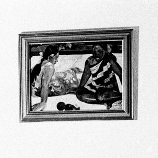 Person reading in a room, lit by a lamp.