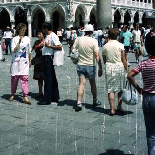People walk near the Doge's Palace in Venice, Italy.