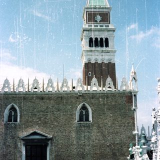 Here's a brief summary: Close-up of the Campanile (bell tower) in Venice, Italy.