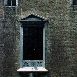 Here's a brief summary: Close-up of the Campanile (bell tower) in Venice, Italy.