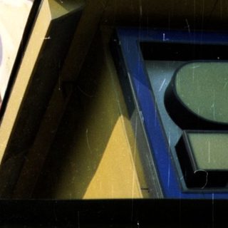 Building facade with a marquee advertising a show.
