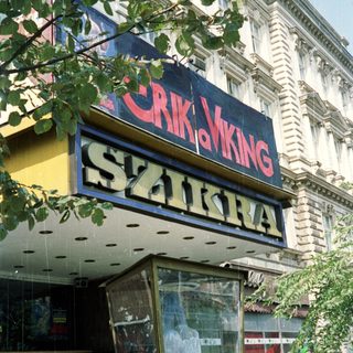 Exterior view of a building with "Viking" and "Szikra" signage.
