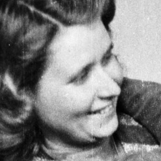 Woman and child embracing in a vintage, black and white photograph.