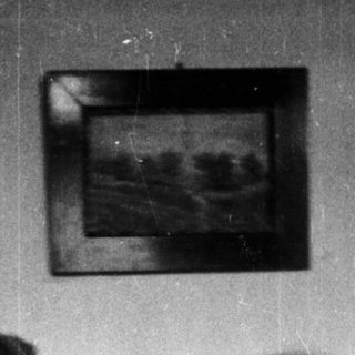 Woman and child embracing in a vintage, black and white photograph.