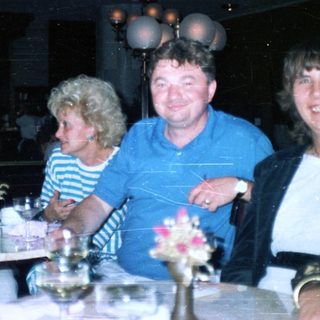 Group of people dining at a restaurant with decor.