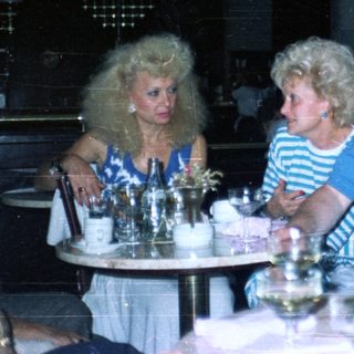 Group of people dining at a restaurant with decor.