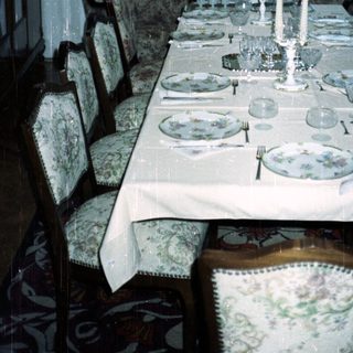 Elegant dining room with a formally set table.