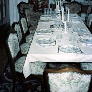Elegant dining room with a formally set table.