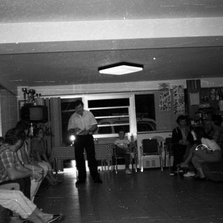 Group gathered in a room, possibly for a presentation.