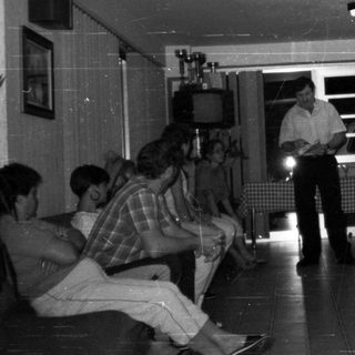 Group gathered in a room, possibly for a presentation.