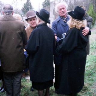 Group of people gathered outdoors, likely in a formal setting.