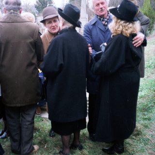 Group of people gathered outdoors, likely in a formal setting.