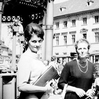 Three people posing outdoors, likely celebrating an achievement.