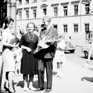 Black and white photo of a couple and well-wishers.