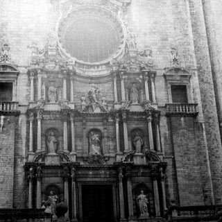 Ornate, monochrome facade of a grand, historic building.