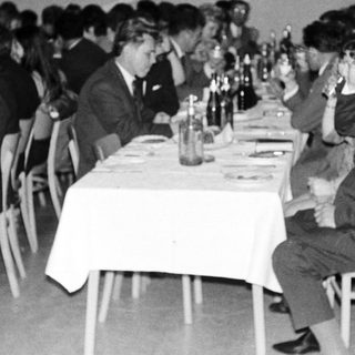 Group of people at a formal dinner or gathering.