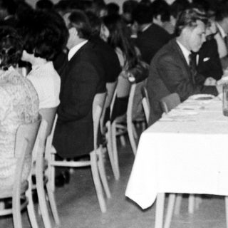Group of people at a formal dinner or gathering.