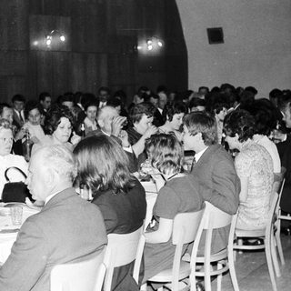 Group of people dining at a formal event.