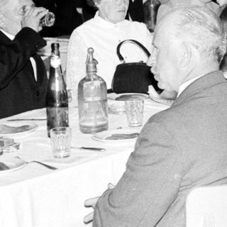 Group of people dining at a formal event.