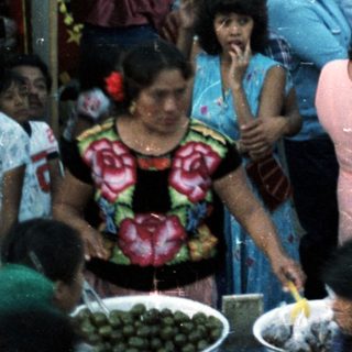 Crowded gathering of people, likely a community celebration.