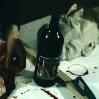 Person preparing or dissecting an animal carcass.