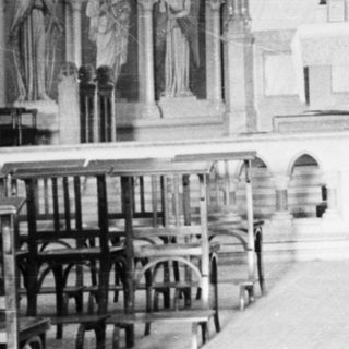 Interior of a church with altar and statues.