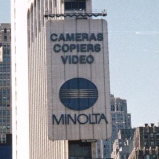 Times Square street scene with prominent advertising displays.