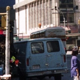Times Square street scene with prominent advertising displays.