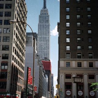 Street scene in New York City with the Empire State Building.