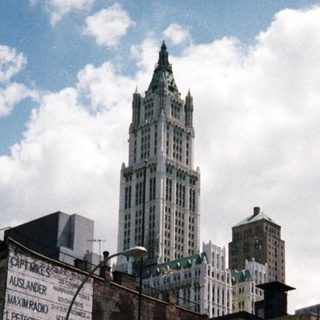 Bank building and a tall building in a city street.
