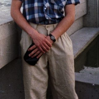 Man poses near Niagara Falls with a view.