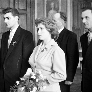 Black and white photo of a wedding party.