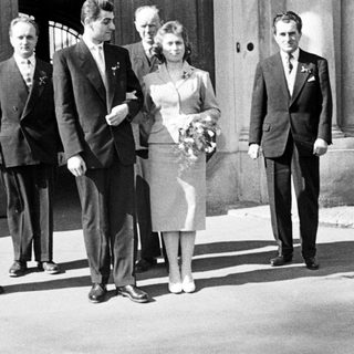 Black and white photo of a wedding party outside.